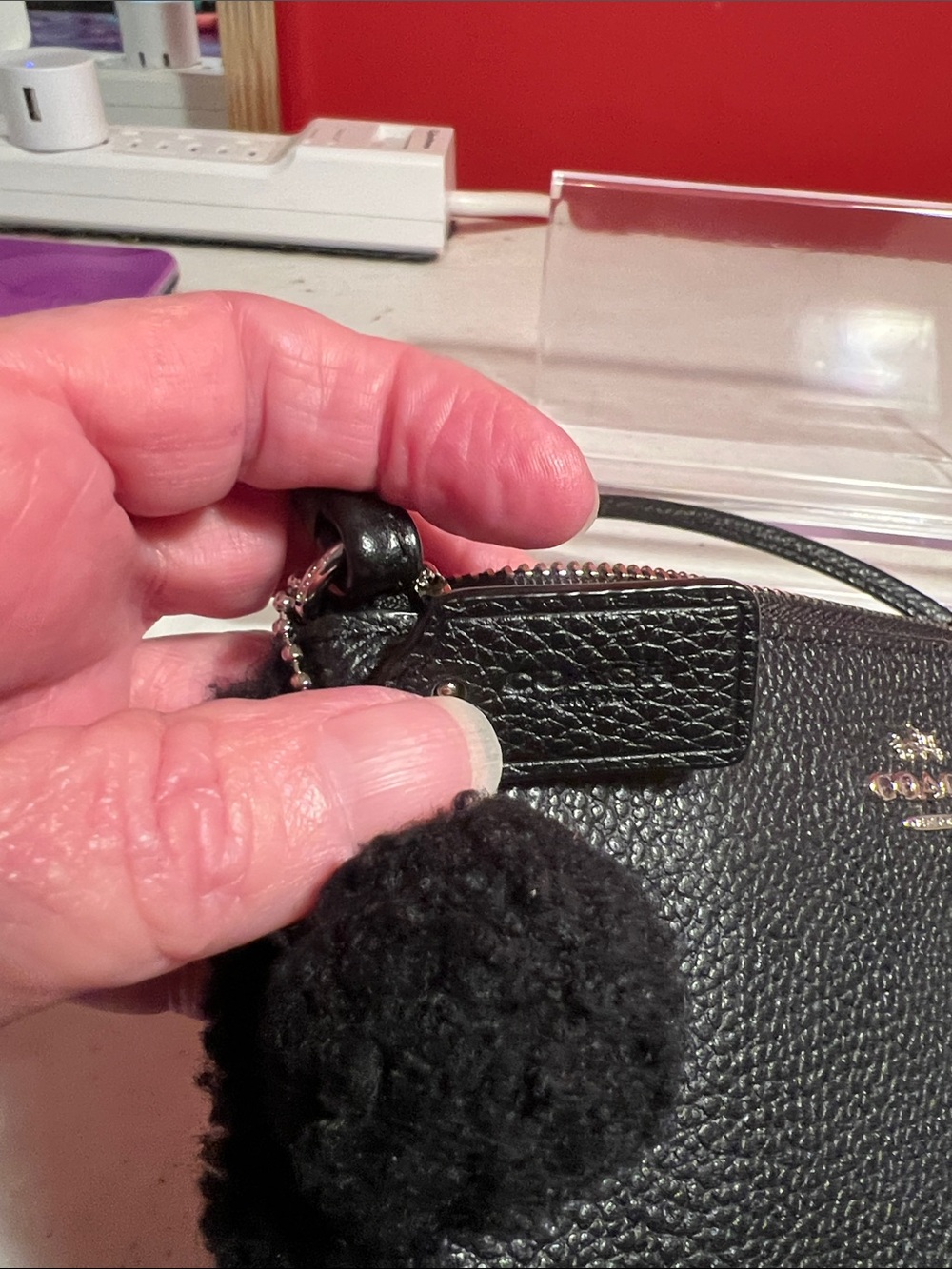 Coach Black Pebbled Leather Shearling-Trim Wristlet - Picture 13 of 14